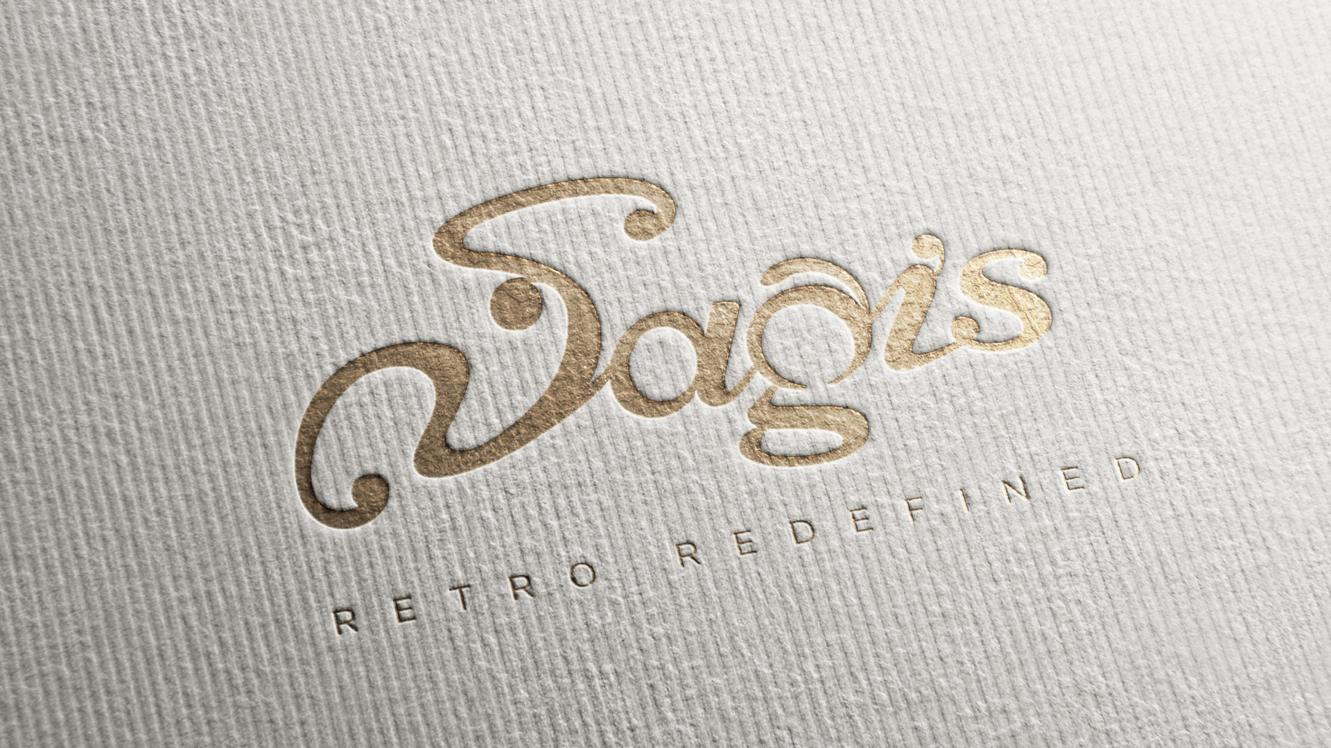 Saagis logo debossed in gold foil on textured paper